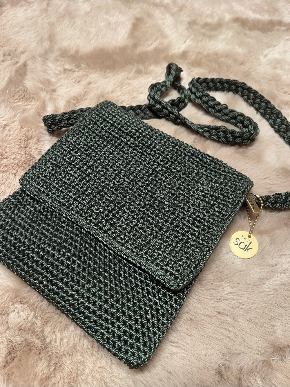 The Sak Dark Green Woven Crossbody Bag with Gold Charm